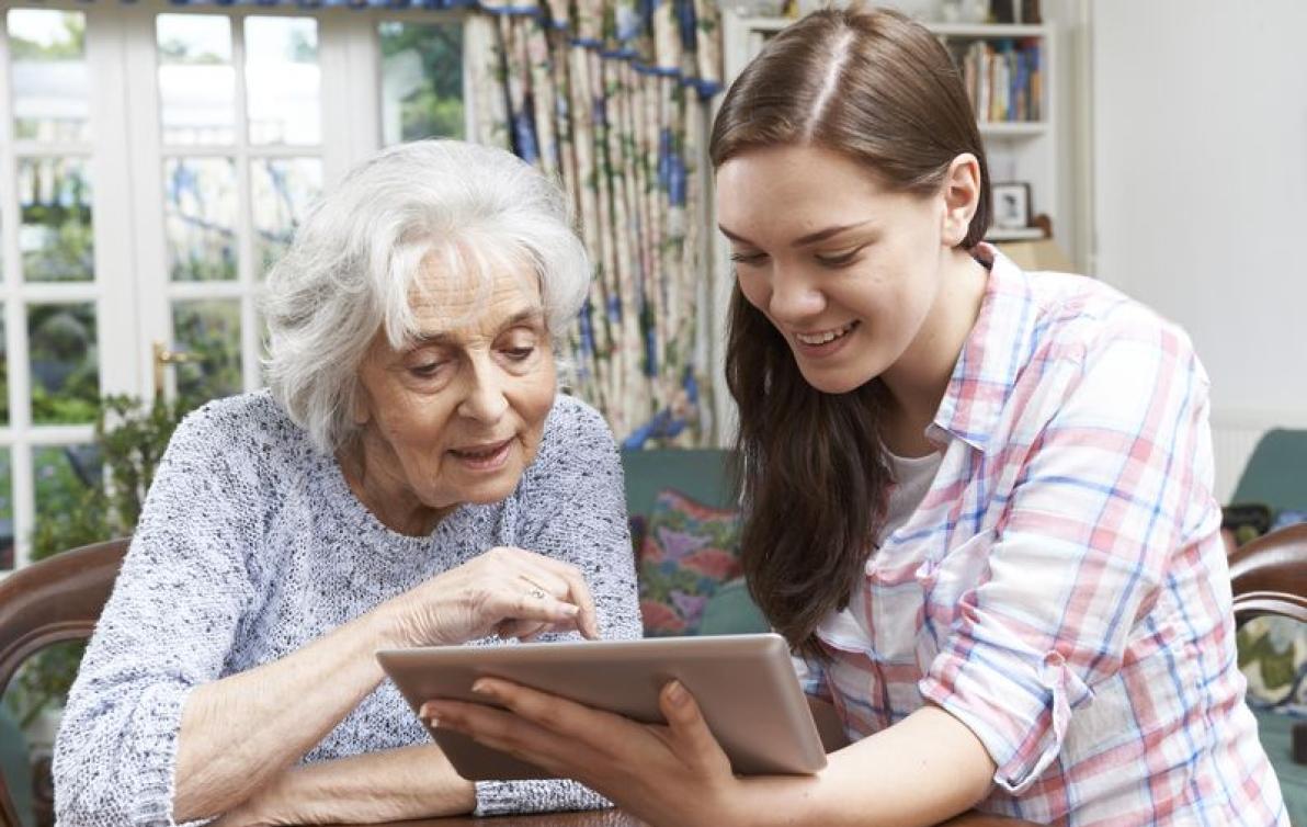 Carer assisting elderly lady