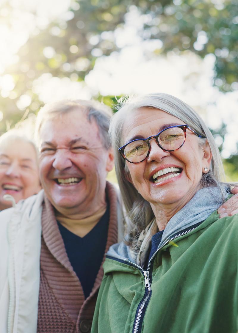 elderly couple taking a selfie at the park