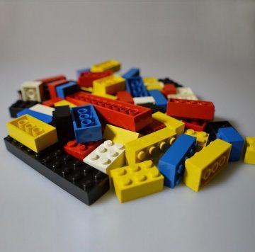 A small pile of different coloured lego blocks